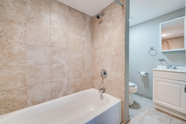 full bathroom with toilet, vanity, tiled shower / bath combo, and tile patterned floors