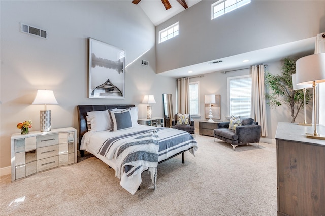 carpeted bedroom featuring beamed ceiling, high vaulted ceiling, multiple windows, and ceiling fan