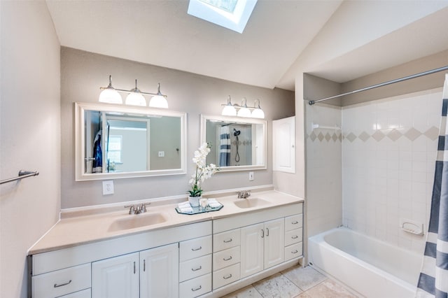 bathroom with shower / tub combo with curtain, a sink, double vanity, and a skylight