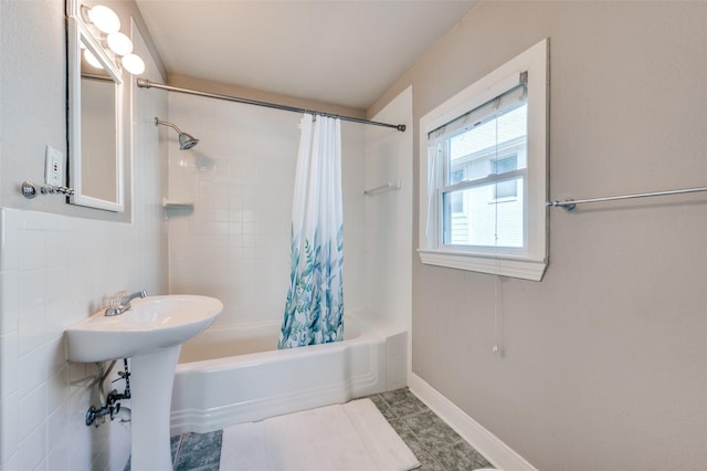 bathroom featuring tile patterned floors and shower / bath combo with shower curtain