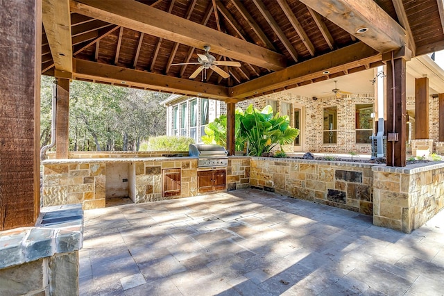 view of patio with a gazebo, ceiling fan, area for grilling, and grilling area