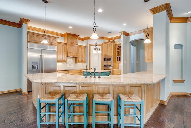 kitchen with built in appliances, a breakfast bar, kitchen peninsula, and dark hardwood / wood-style floors