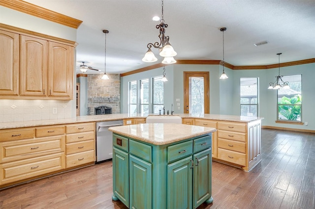 143 Coldwater Creek Ln, Weatherford, TX 76088 - kitchen with stainless steel dishwasher, a center island, a sink, a chandelier, and green cabinets