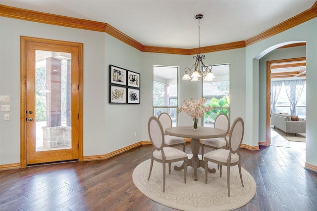 143 Coldwater Creek Ln, Weatherford, TX 76088 - dining room with plenty of natural light, dark wood-style floors, arched walkways, baseboards, and ornamental molding