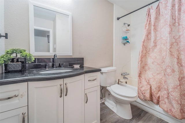 full bathroom featuring vanity, shower / bath combination with curtain, toilet, and wood-type flooring