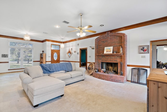 living room with a fireplace, light colored carpet, and ornamental molding