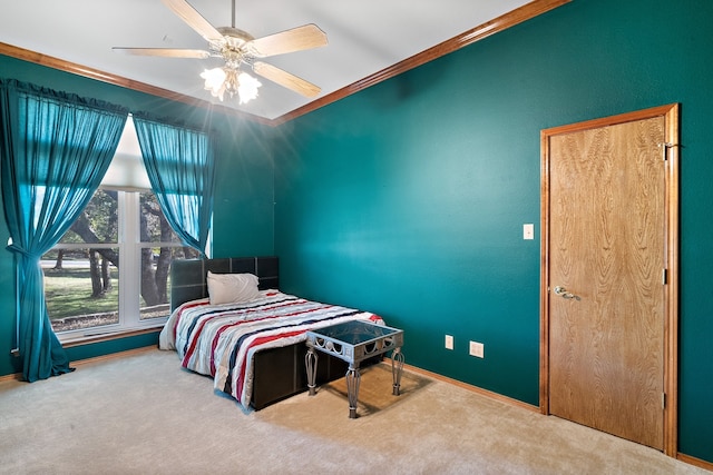 bedroom with carpet flooring, ceiling fan, and ornamental molding