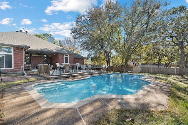 view of pool with a wooden deck