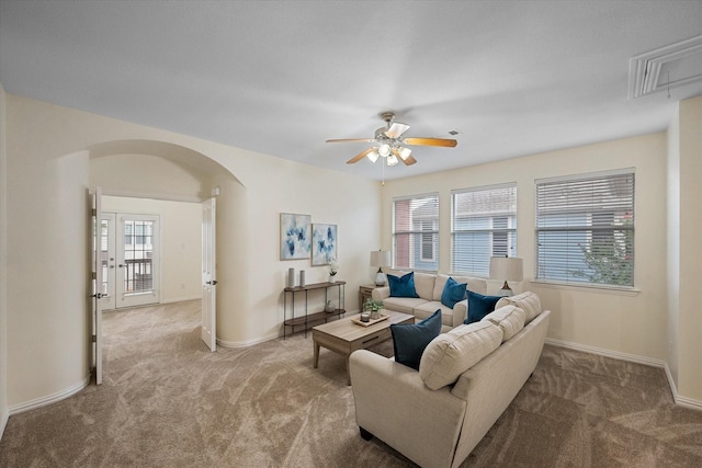 living room featuring ceiling fan and carpet floors