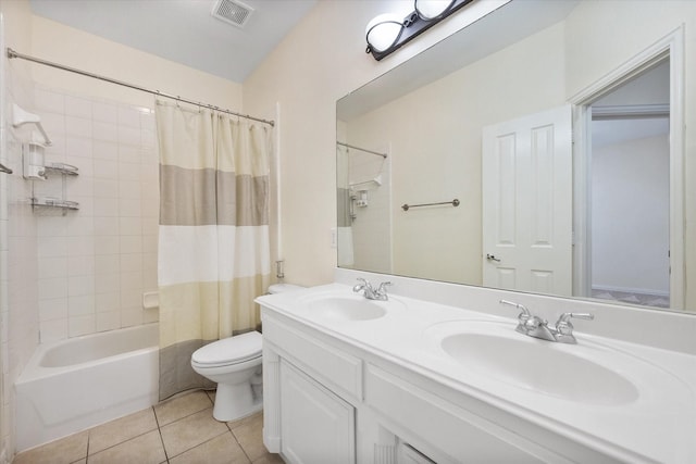 full bathroom featuring toilet, vanity, tile patterned floors, and shower / bathtub combination with curtain