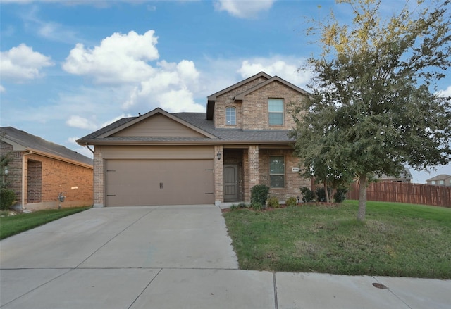 view of front of home with a garage and a front yard