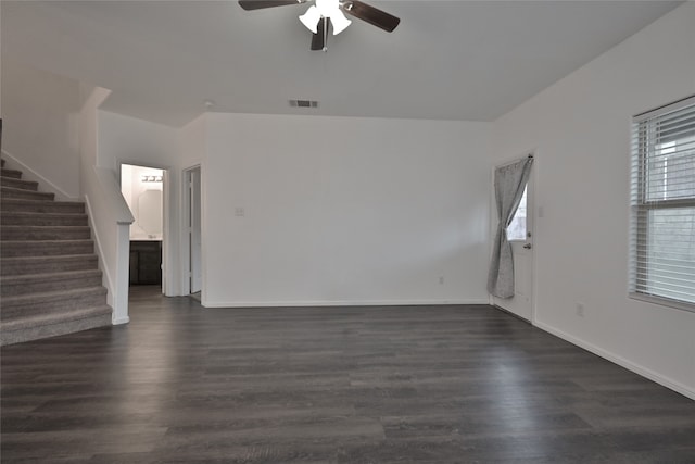 unfurnished room with dark hardwood / wood-style floors and ceiling fan