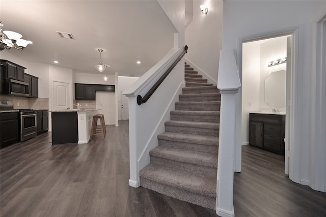 staircase featuring hardwood / wood-style flooring