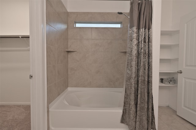 bathroom with tile patterned floors and shower / bathtub combination with curtain