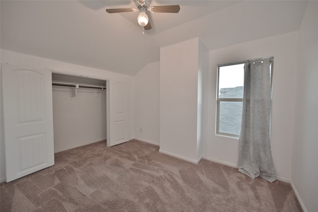 unfurnished bedroom featuring ceiling fan, light colored carpet, and a closet