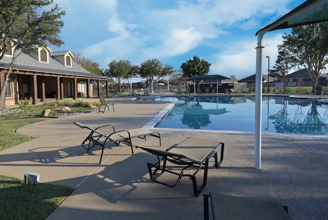 view of swimming pool featuring a patio