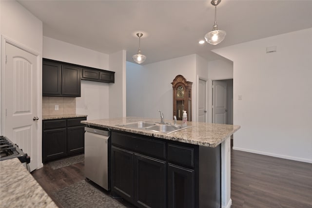 kitchen featuring sink, stainless steel dishwasher, dark hardwood / wood-style floors, decorative light fixtures, and a kitchen island with sink