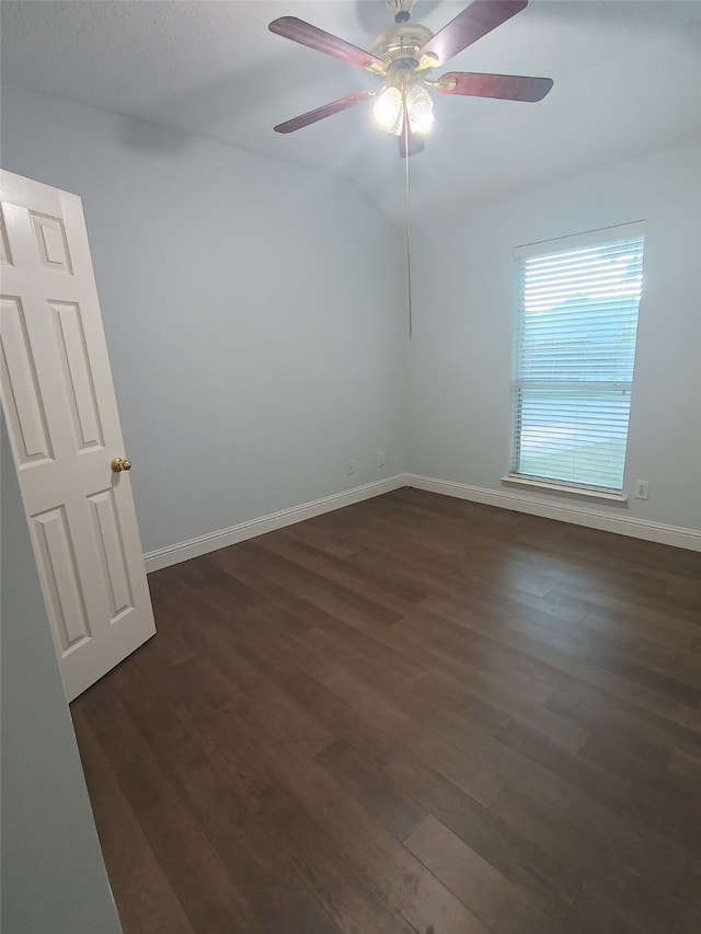 unfurnished room with ceiling fan and dark wood-type flooring