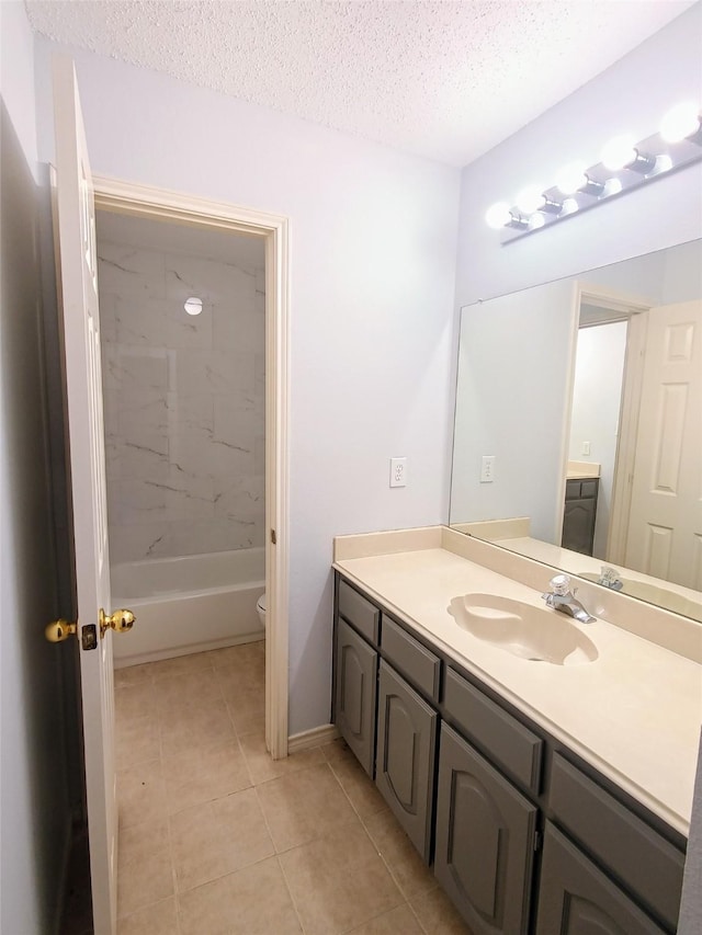 340 Thomas Dr, Murphy, TX 75094 - full bathroom featuring vanity, tile patterned floors, a textured ceiling, and shower / washtub combination