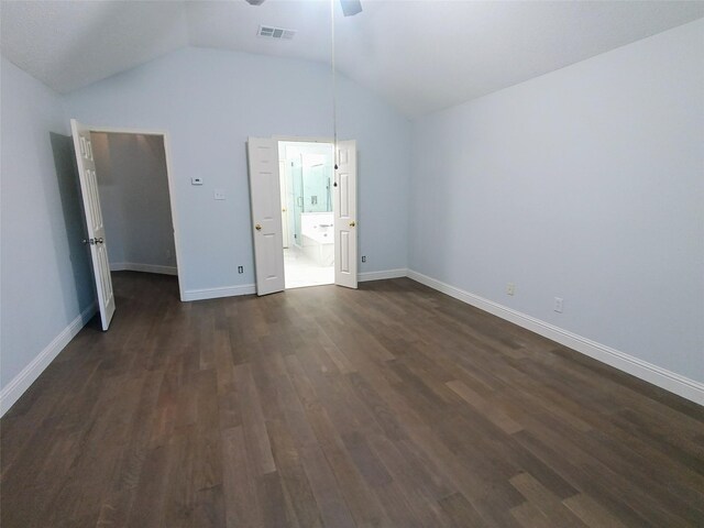 unfurnished bedroom featuring ceiling fan, dark hardwood / wood-style floors, and lofted ceiling