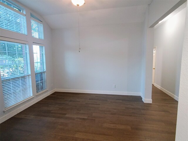 340 Thomas Dr, Murphy, TX 75094 - spare room with dark wood-style flooring and lofted ceiling