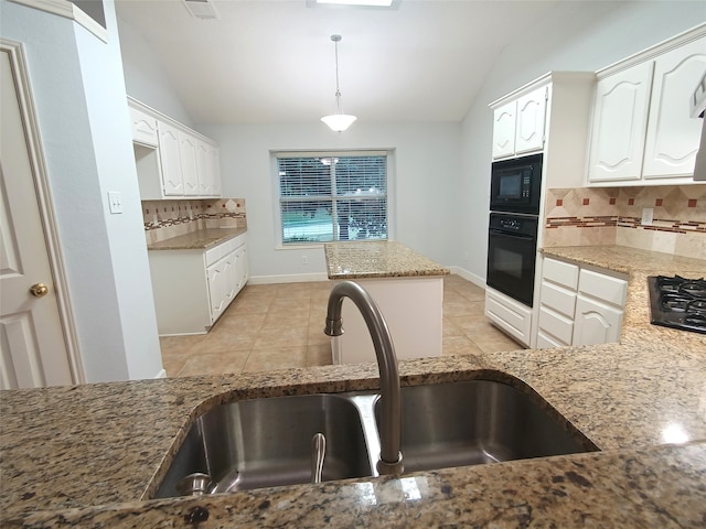 kitchen featuring tasteful backsplash, sink, black appliances, and vaulted ceiling