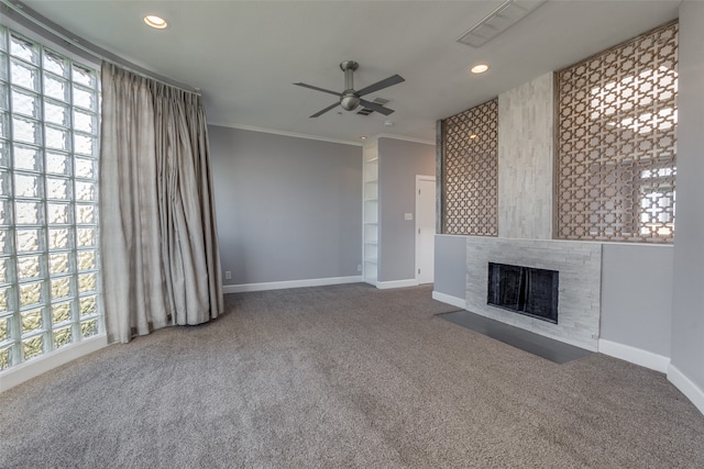 unfurnished living room with carpet floors, ceiling fan, and crown molding