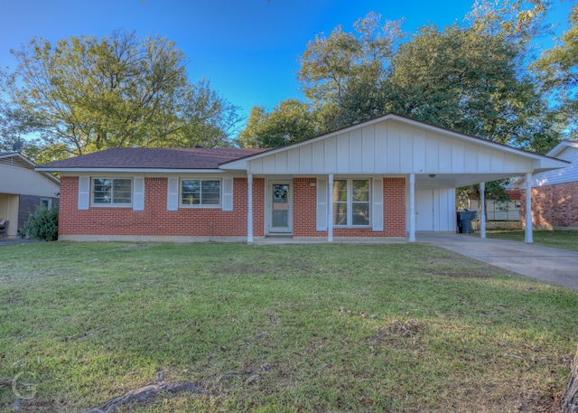 single story home featuring a front lawn and a carport