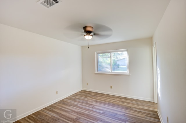 unfurnished room with light hardwood / wood-style flooring and ceiling fan