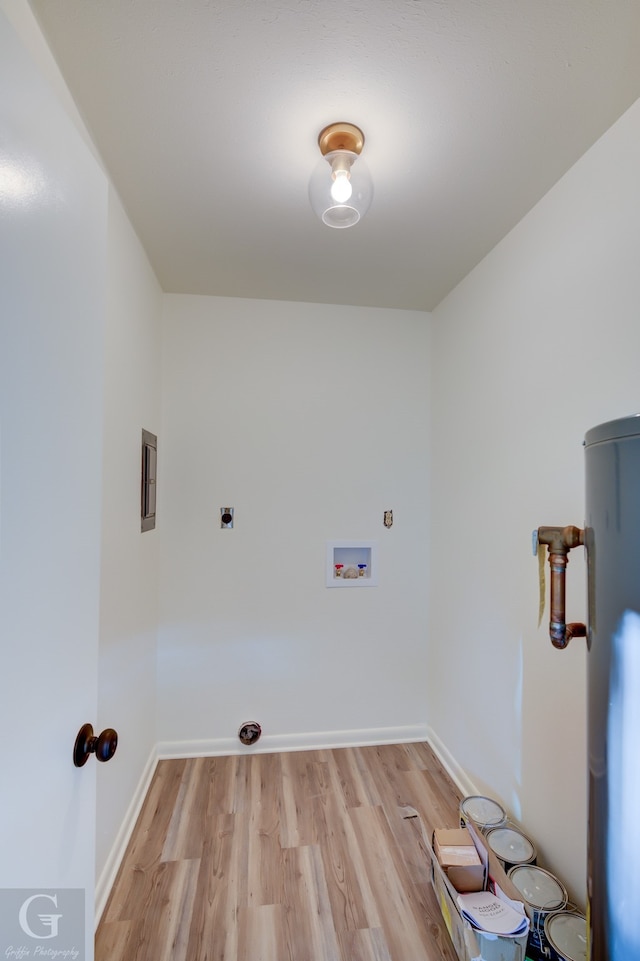 washroom with hookup for an electric dryer, washer hookup, and light hardwood / wood-style floors