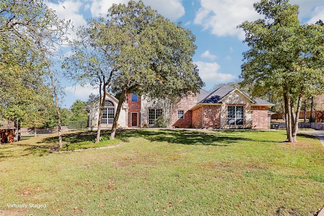 view of front of home with a front lawn