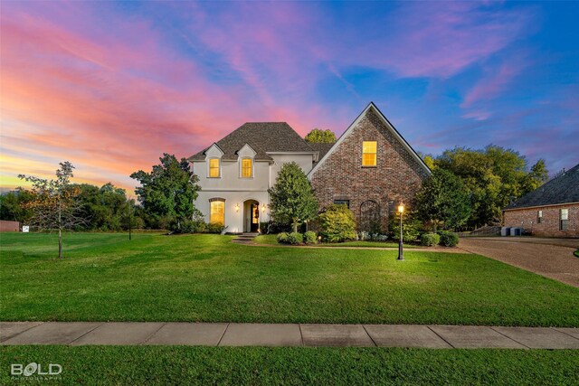 213 Horseguards Ave, Bossier City, LA 71111 - french provincial home with a yard and stucco siding