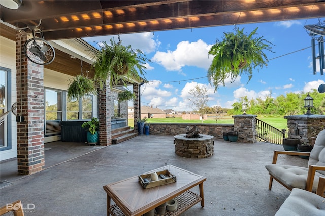 view of patio featuring a fire pit