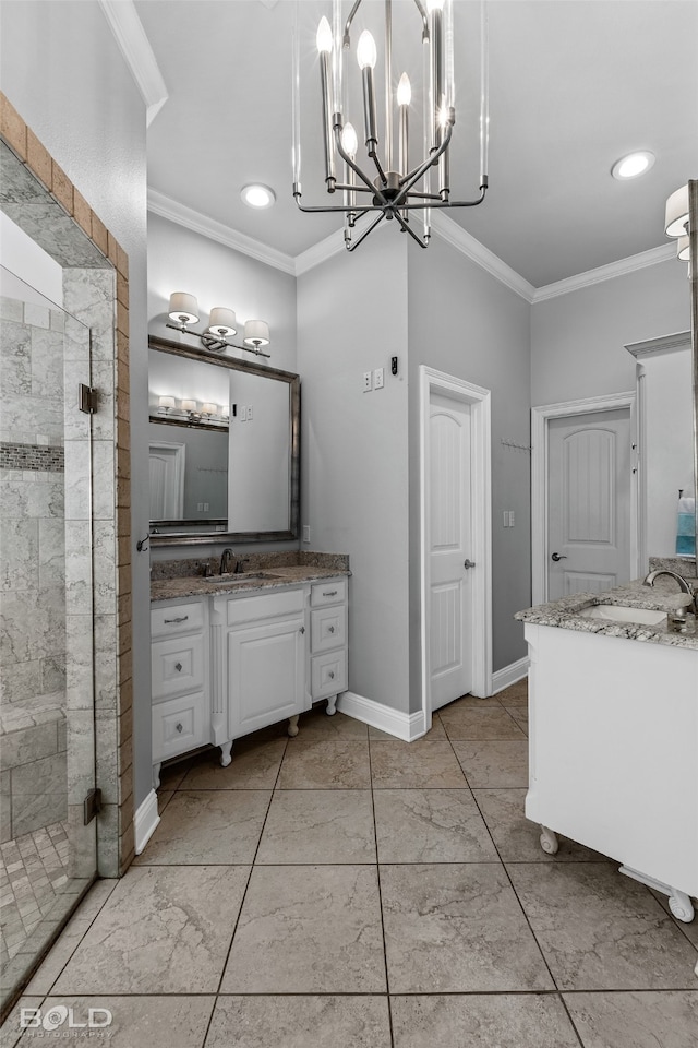 bathroom with vanity, a shower with shower door, and crown molding