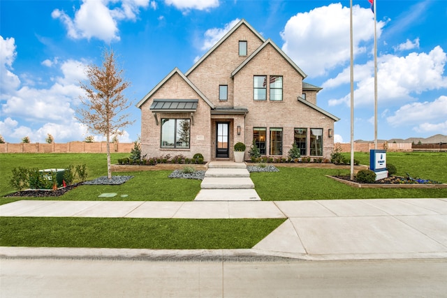 view of front of home with a front yard