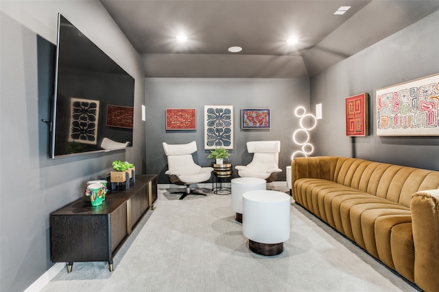 living room with carpet flooring and vaulted ceiling