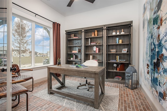 office featuring ceiling fan and a healthy amount of sunlight