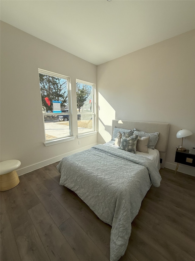 bedroom featuring dark hardwood / wood-style flooring