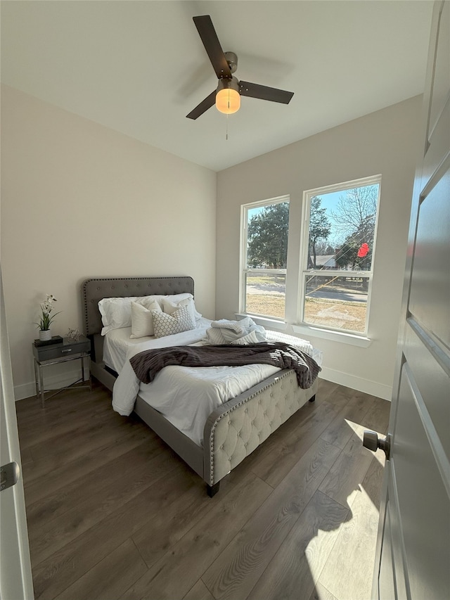 bedroom featuring dark wood-type flooring and ceiling fan