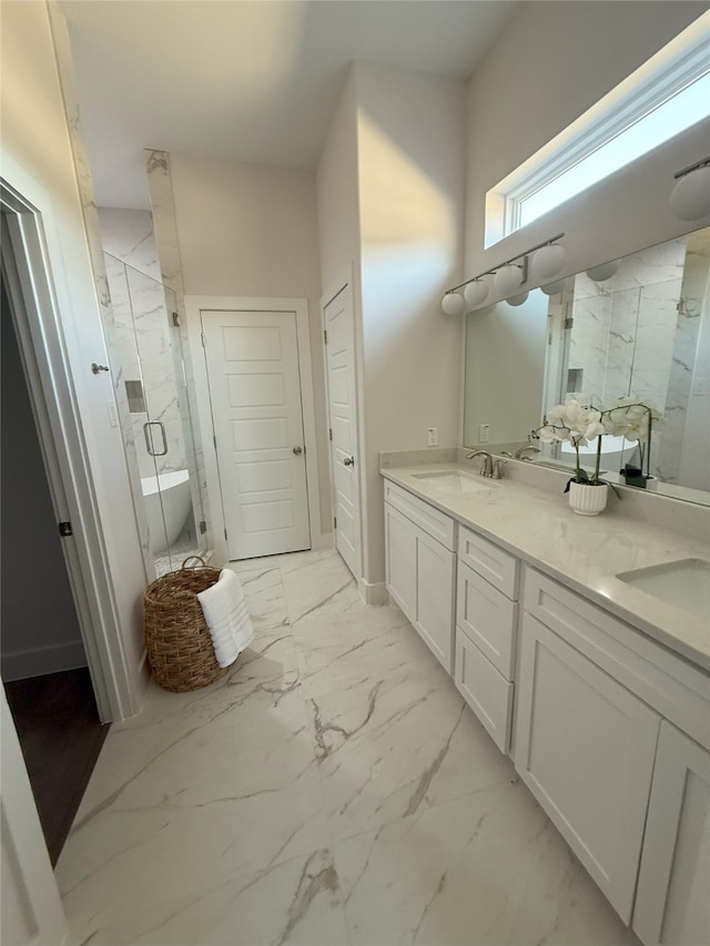 bathroom featuring vanity and separate shower and tub