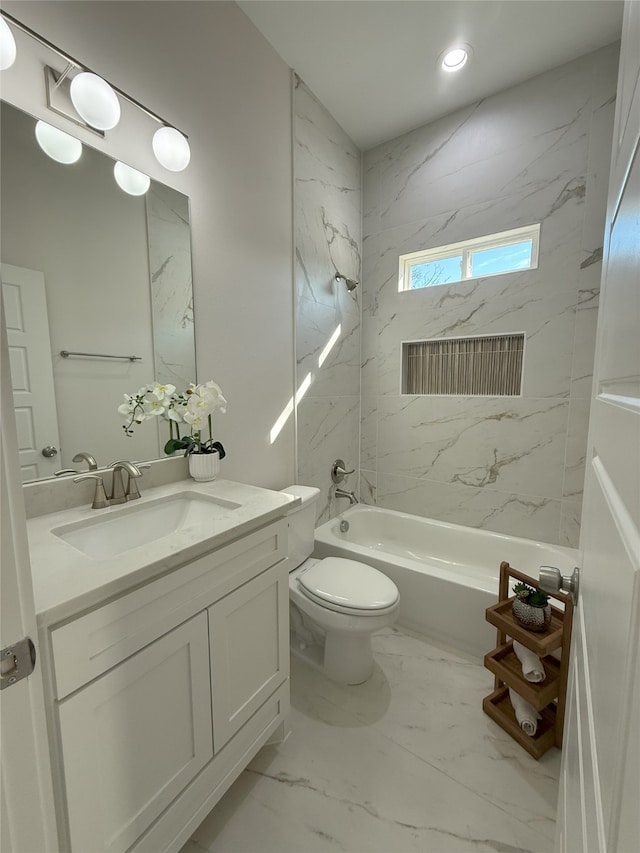 full bathroom with vanity, toilet, and tiled shower / bath combo