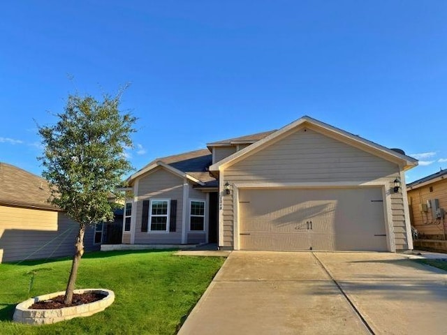 view of front of property with a garage and a front yard