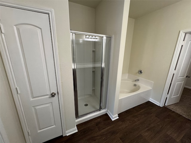 bathroom with hardwood / wood-style floors, vanity, and toilet