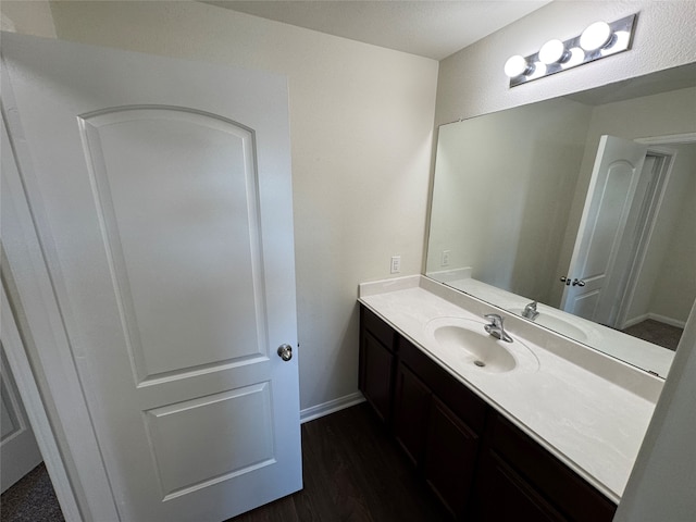 bathroom featuring hardwood / wood-style flooring and toilet