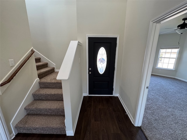 foyer entrance with ceiling fan and dark hardwood / wood-style floors