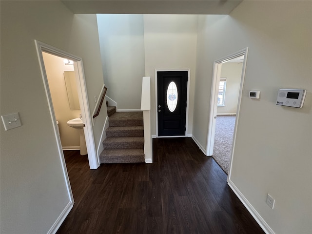 clothes washing area with hookup for an electric dryer, gas dryer hookup, hardwood / wood-style flooring, and washer hookup