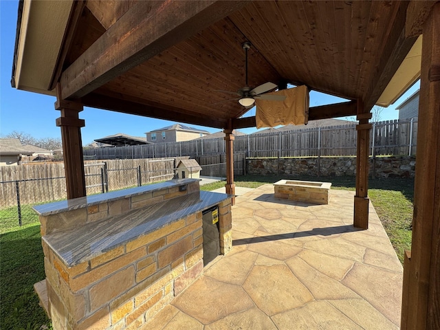 view of patio / terrace featuring area for grilling and ceiling fan