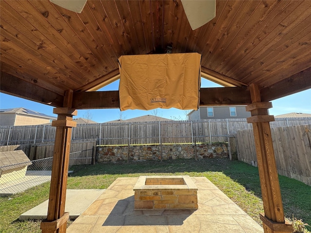 view of patio featuring an outdoor fire pit