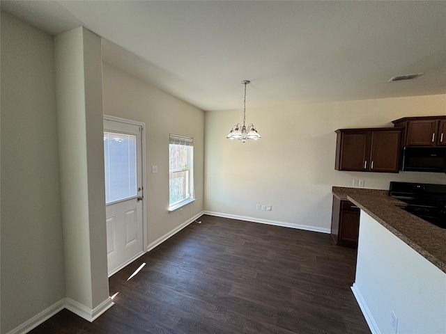 empty room featuring ceiling fan and dark carpet