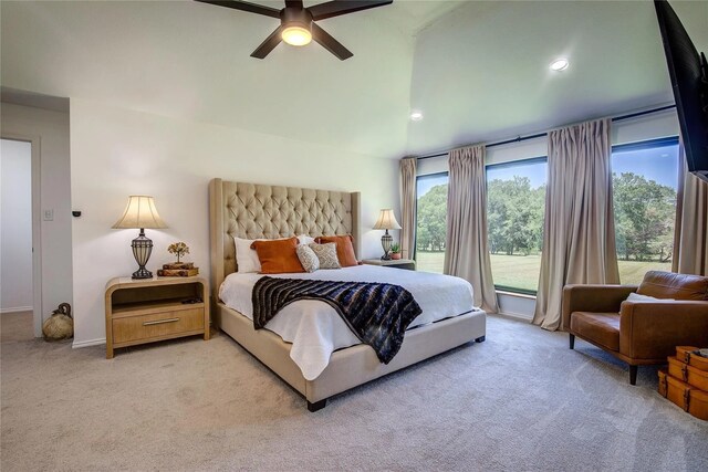 carpeted bedroom with vaulted ceiling and ceiling fan